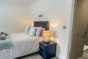 Madrona_Valley_Anglesey_king_bedroom_ensuite_3_1920x1080